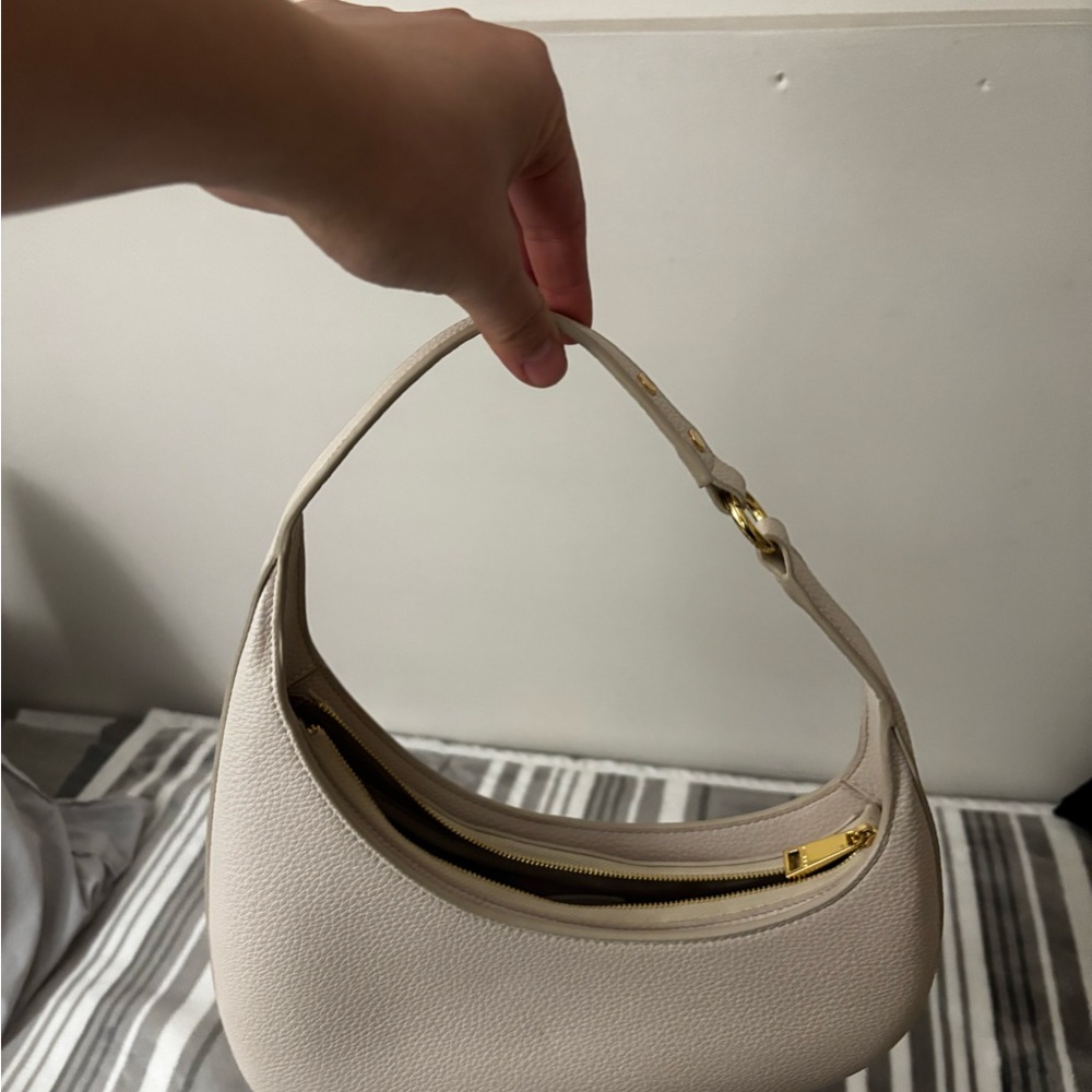 JW PEI Cream Shoulder Bag with Gold Accents and Crescent Shape